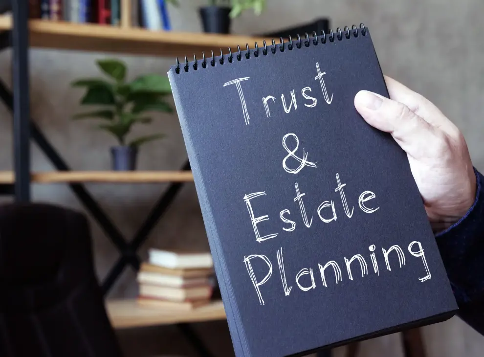 Close-up of a book with the word "Trust" on the cover.