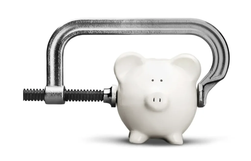 Piggy bank on the verge of breaking, representing spendthrift habits.